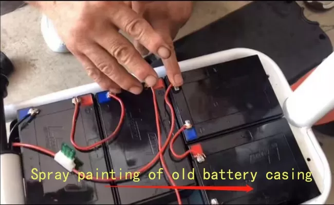 Spray painting of old electric cabin scooter battery casing