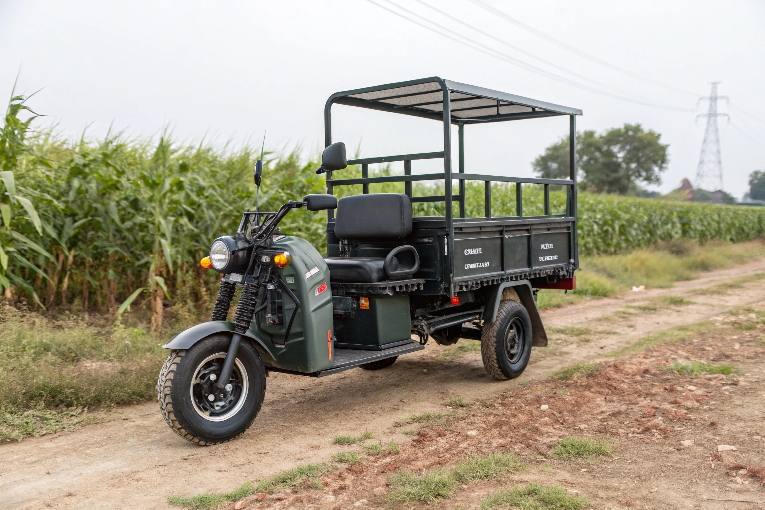 An electric agricultural tricycle loaded with produce, operating in a field with a farm in the background.