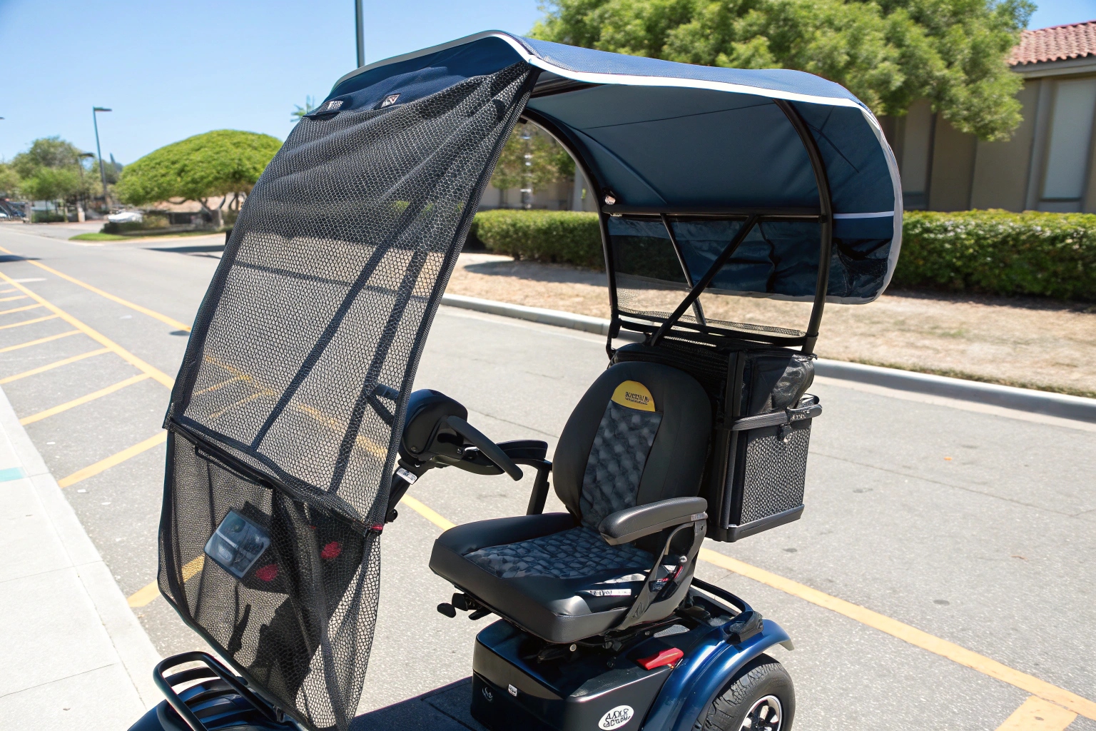 A mobility scooter equipped with both a sun canopy and a black mesh ventilated seat