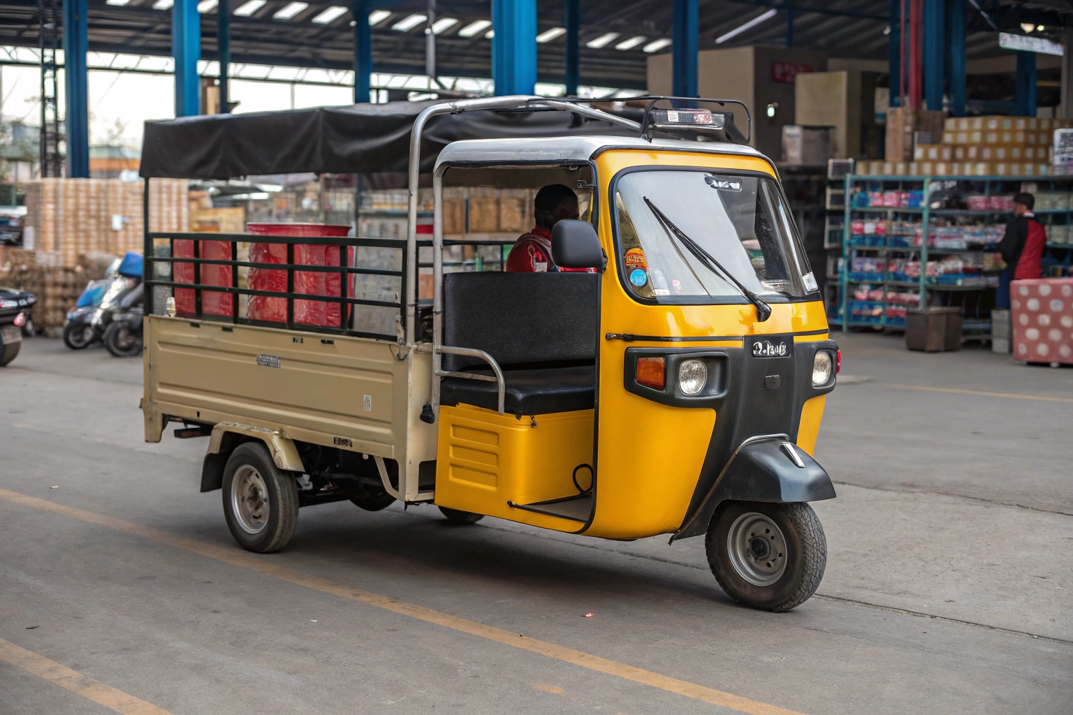 a branded tuk pickup truck making a delivery in a narrow city alley