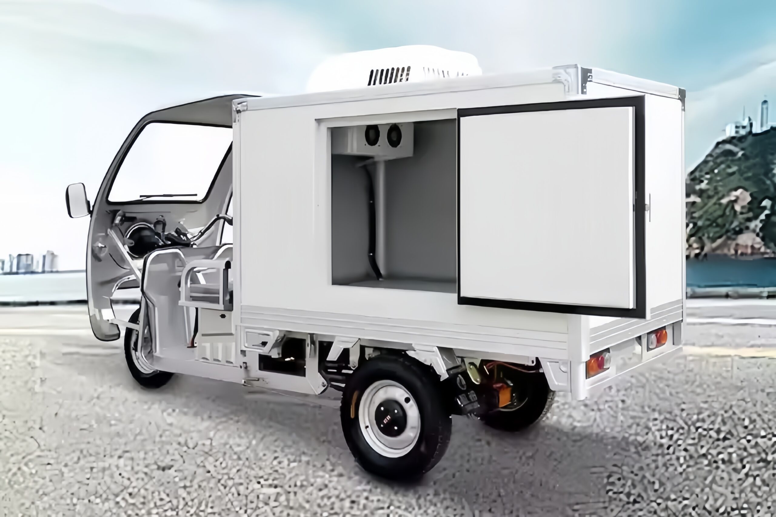 a close-up of a compact DC compressor unit mounted on an electric refrigerated tricycle's box