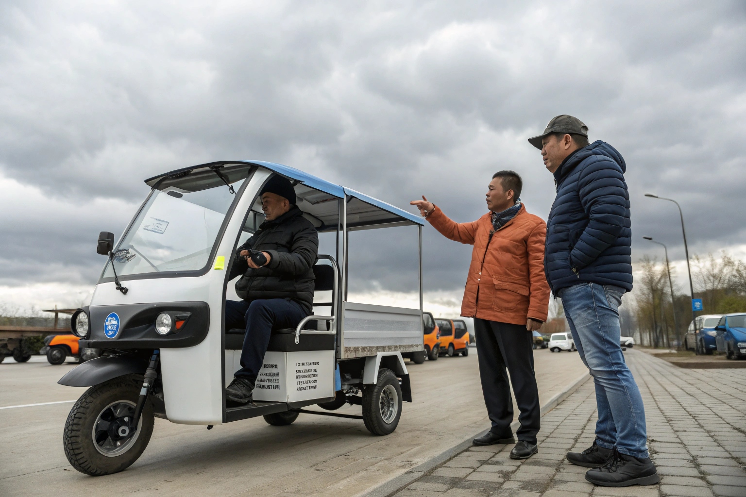 a salesperson pointing to the battery compartment of an electric tricycle while talking to a customer
