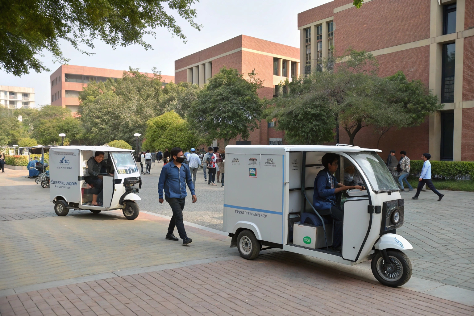 a compact electric refrigerated tricycle parked near a food court inside a modern industrial park