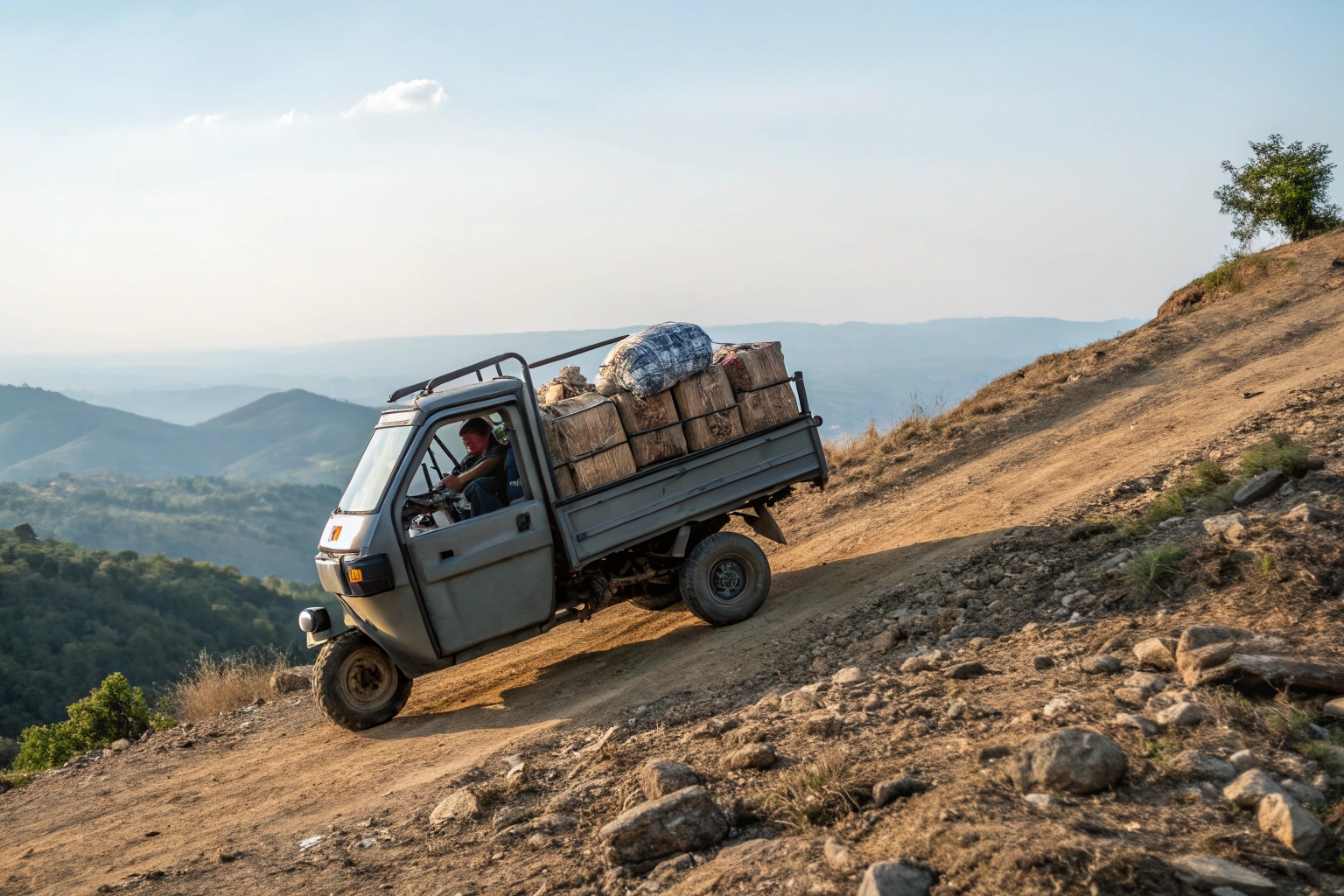 an electric 3 wheel food truck climbing a steep hill with a full load