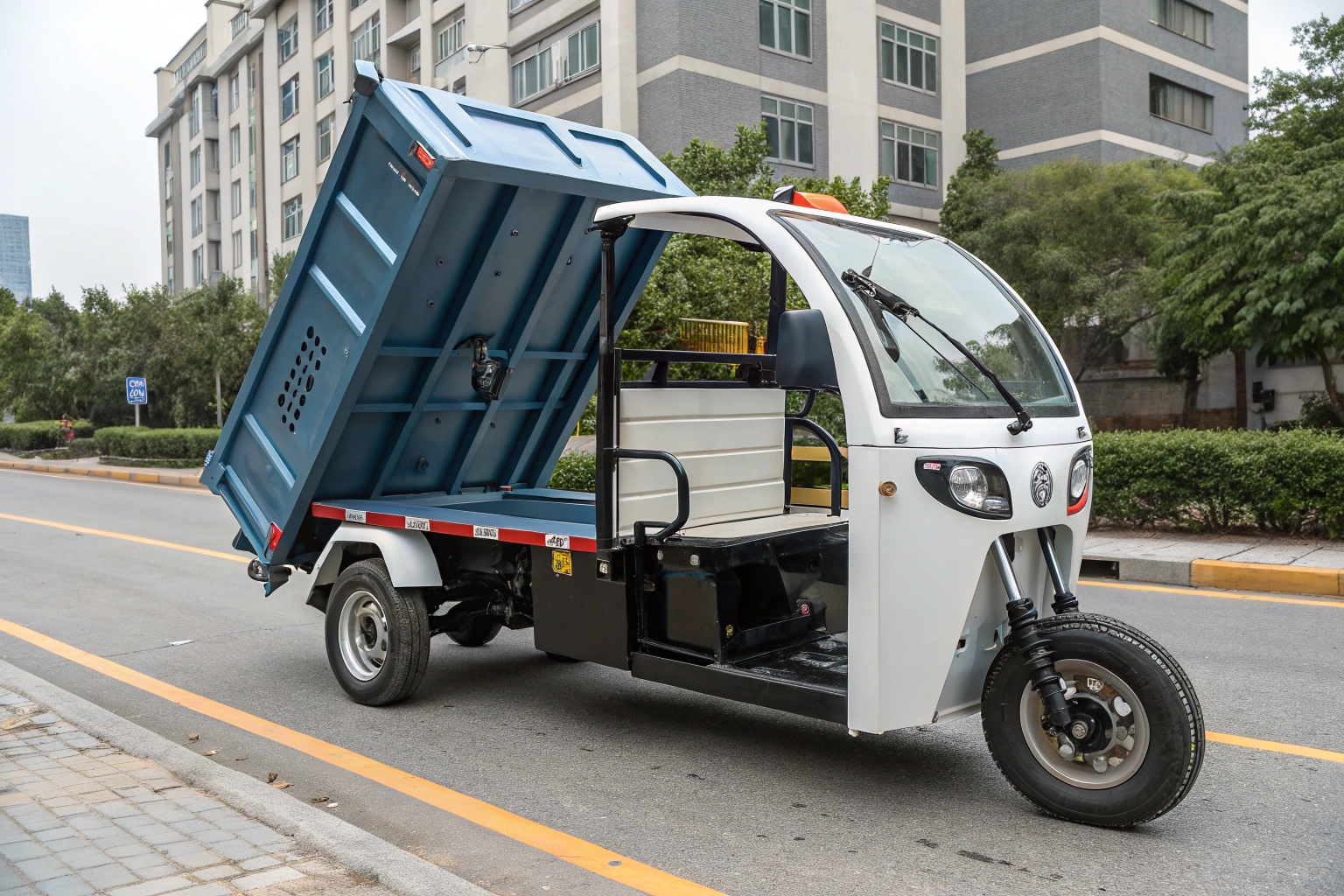 a close-up on the hydraulic tipping mechanism and stainless steel bin of an electric garbage tricycle
