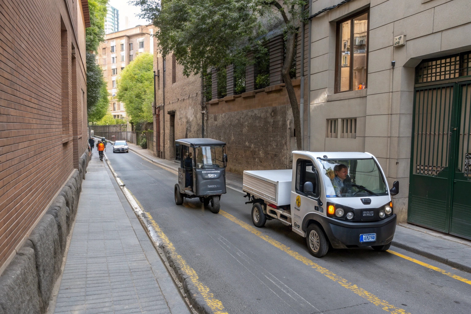 an electric garbage tricycle making a tight turn in a narrow city alley