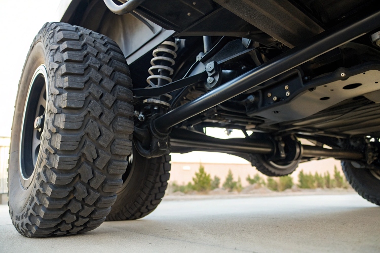 A diagram showing how shocks from the road are absorbed first by the tire, then the suspension