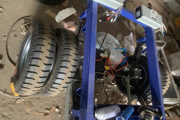 Side-by-side comparison of a standard road tire and a wider off-road tire for a 3-wheeler