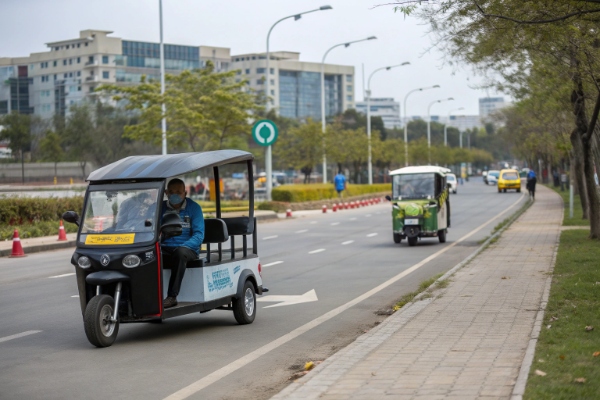 A photo showing two different e-rickshaw routes: a flat resort path and a busy city street with hills